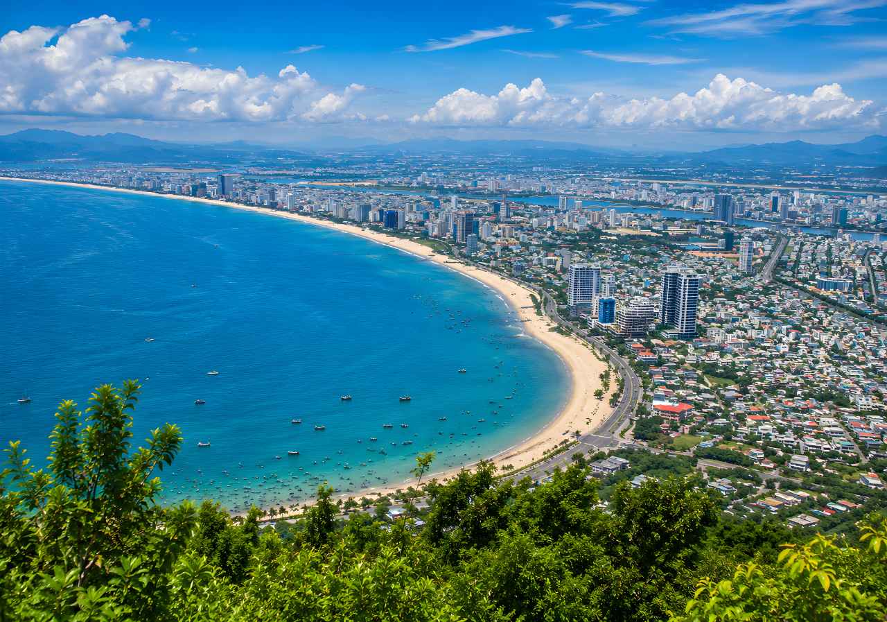 Son Tra Peninsula aerial view showing Da Nang coastline panorama and Monkey Mountain beach vista